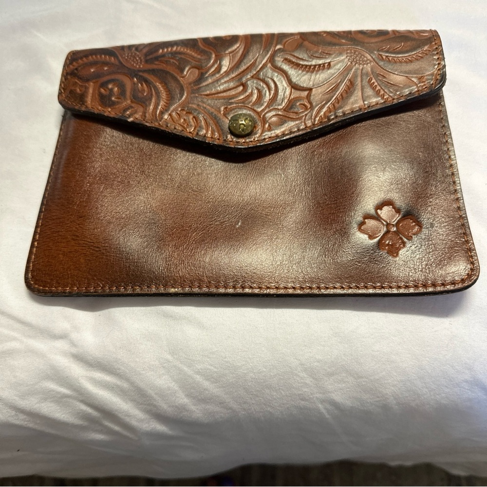 Patricia Nash clutch with embossed with design and Patricia Nash stamp